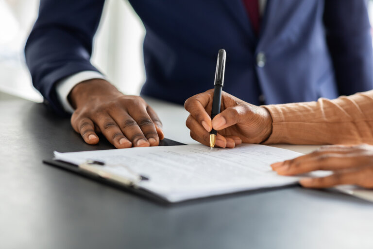 business people looking over contract