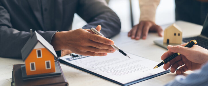 lawyer and client discussing real estate contract dispute in nyc