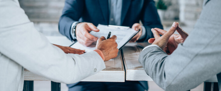 two people sitting with lawyer