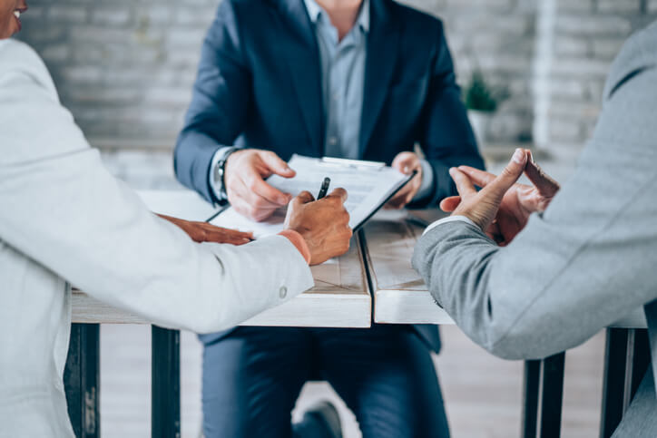 two people sitting with lawyer
