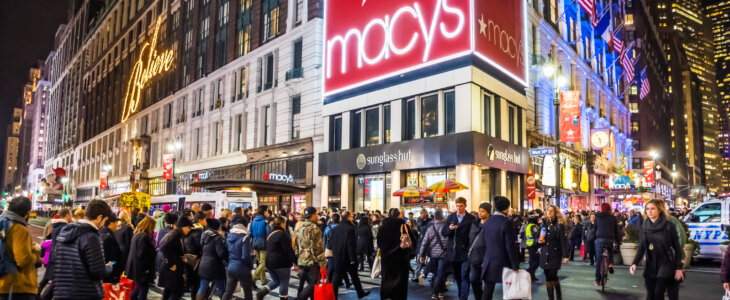 New York, NY, USA - December 21, 2015: A large crowd of shoppers and tourists in Herald Square near Macy’s in New York City.