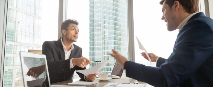 Two company leaders intensely discussing or arguing because of contract terms, can not come to agreement during negotiation, disagree with colleague opinion about business results. Dissatisfied client
